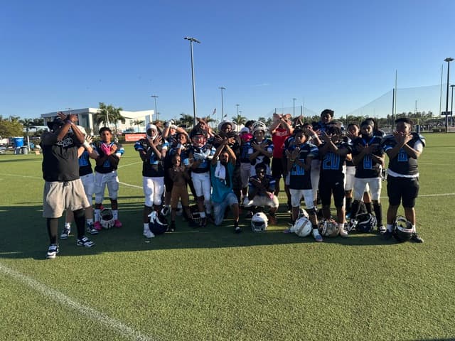 FBU Team Carolina athletes together on the field after a game