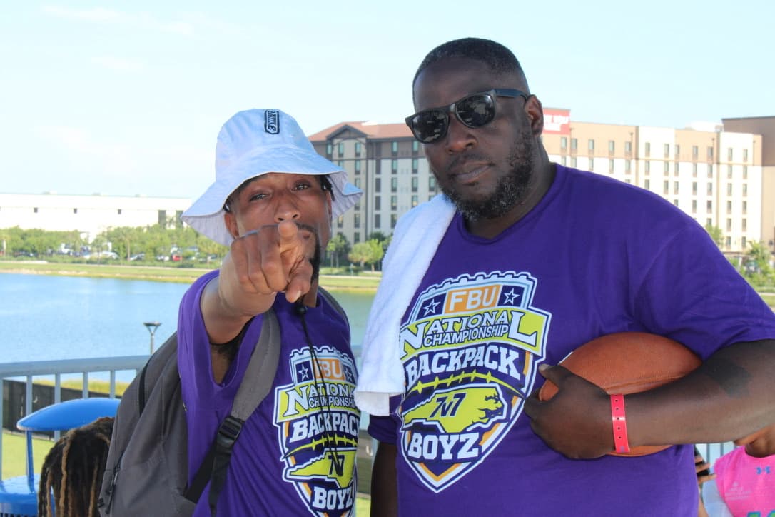 Two FBU Team Carolina coaches in Backpack Boyz national championship shirts
