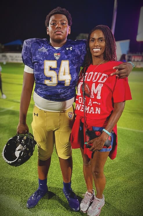 Landrey Thompson with his mother Tamekia on the field after an Under Armour All-American game